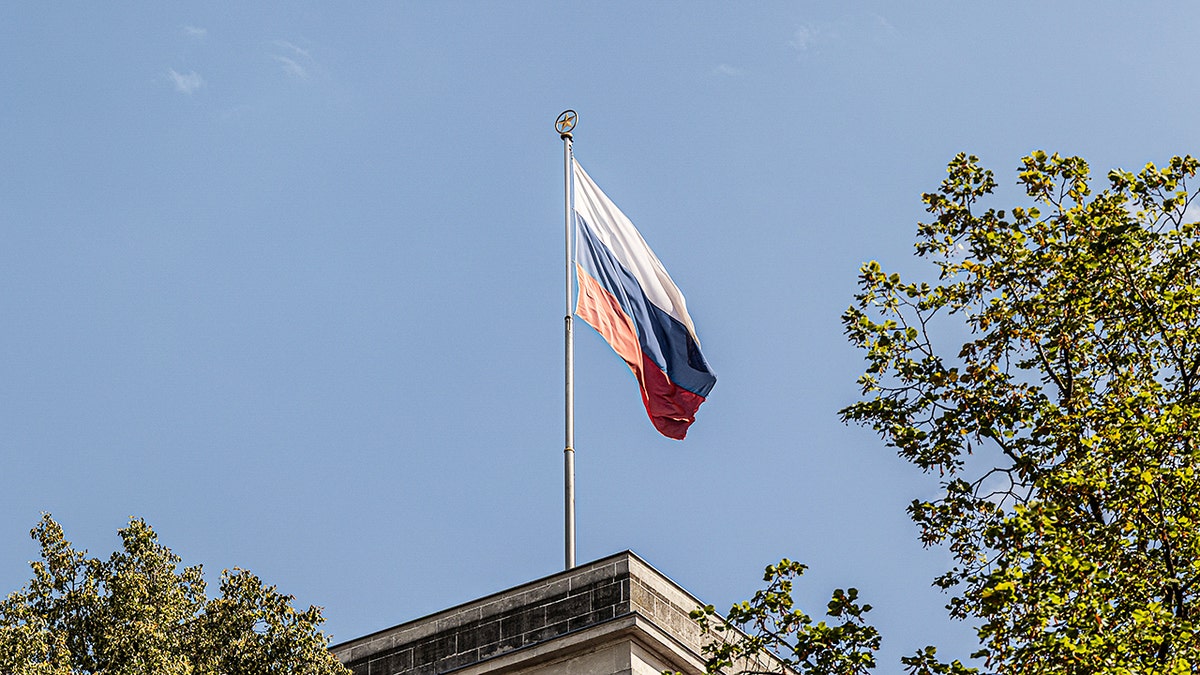 A Russian flag flies above the Russian Embassy in Berlin, Germany.