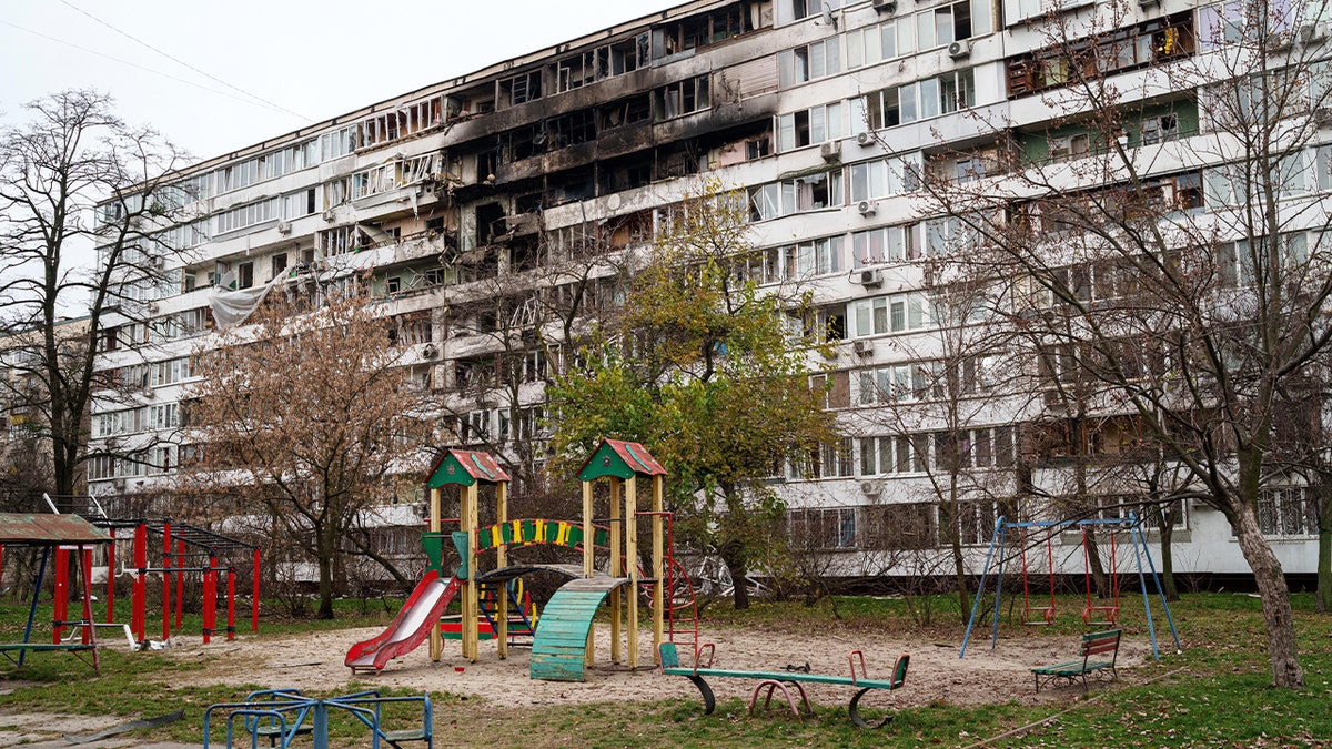 A damaged apartment complex with debris scattered after a Russian strike in Kyiv.