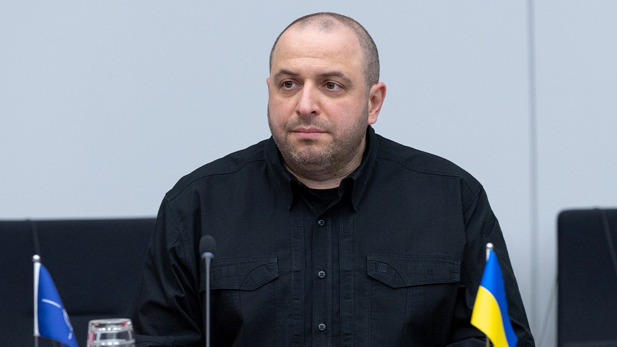 Ukrainian defense chief listens during a high-level NATO gathering focused on security coordination.