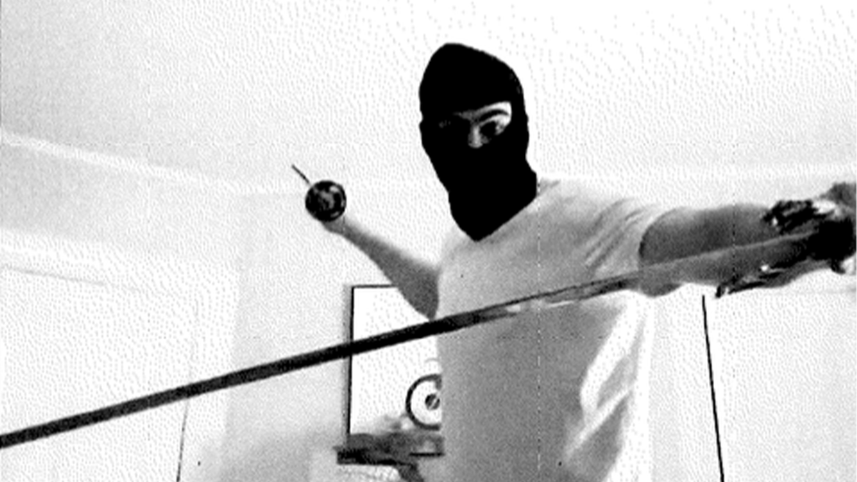 A black and white image that allegedly shows a masked Milo Sedarat posing with swords