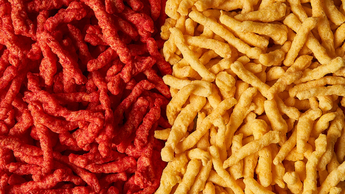 Cheetos Flamin’ Hot Crunchy (left) pictured next to new Simply NKD Cheetos Flamin’ Hot Crunchy (right)
