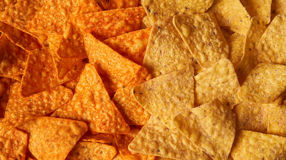 Doritos Nacho cheese (left) pictured next to new Simply NKD Nacho Cheese (right)