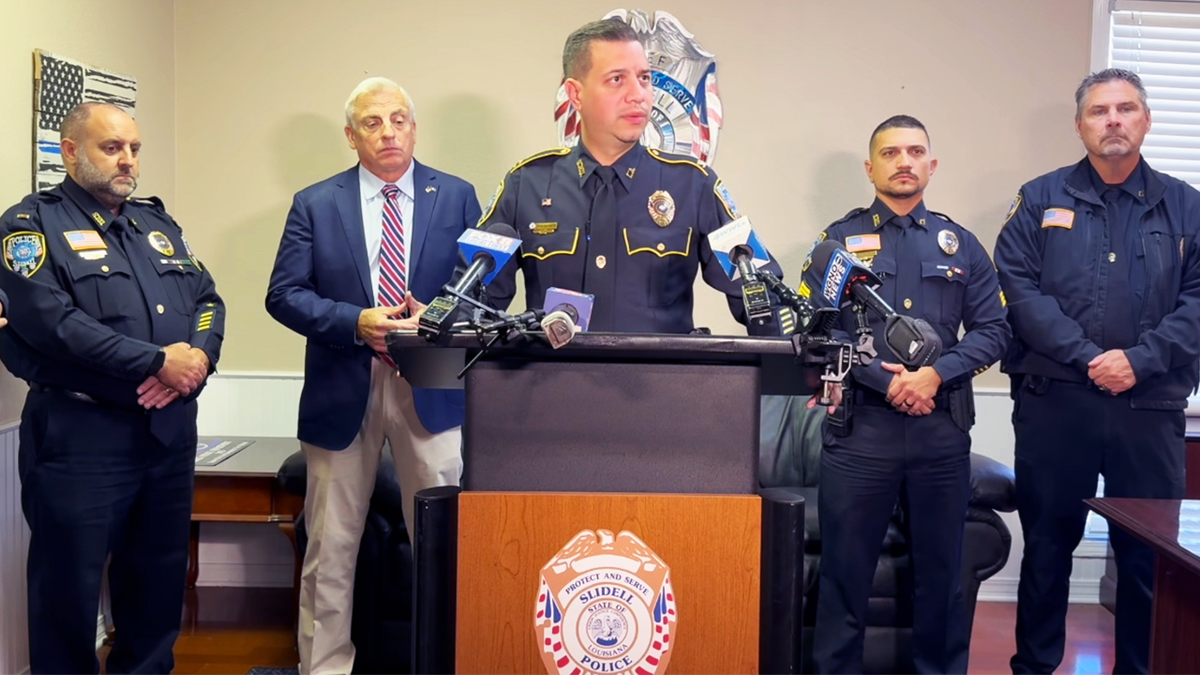 Slidell Police Chief Daniel Seuzeneau speaks at a news conference.