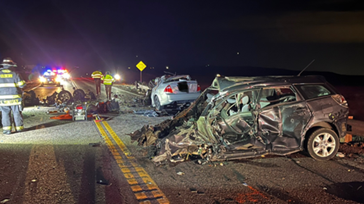 Crews work at the scene of a deadly Colorado highway car crash