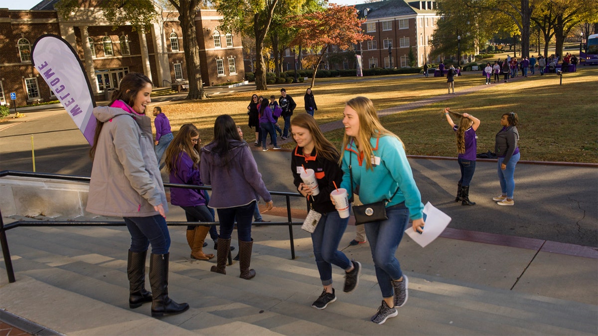 Students walking up stairway on University of Central Arkansas campus