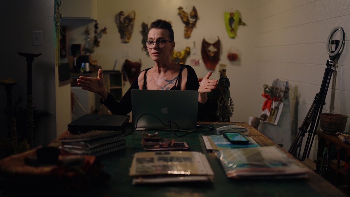 Susan Powter sitting in a room