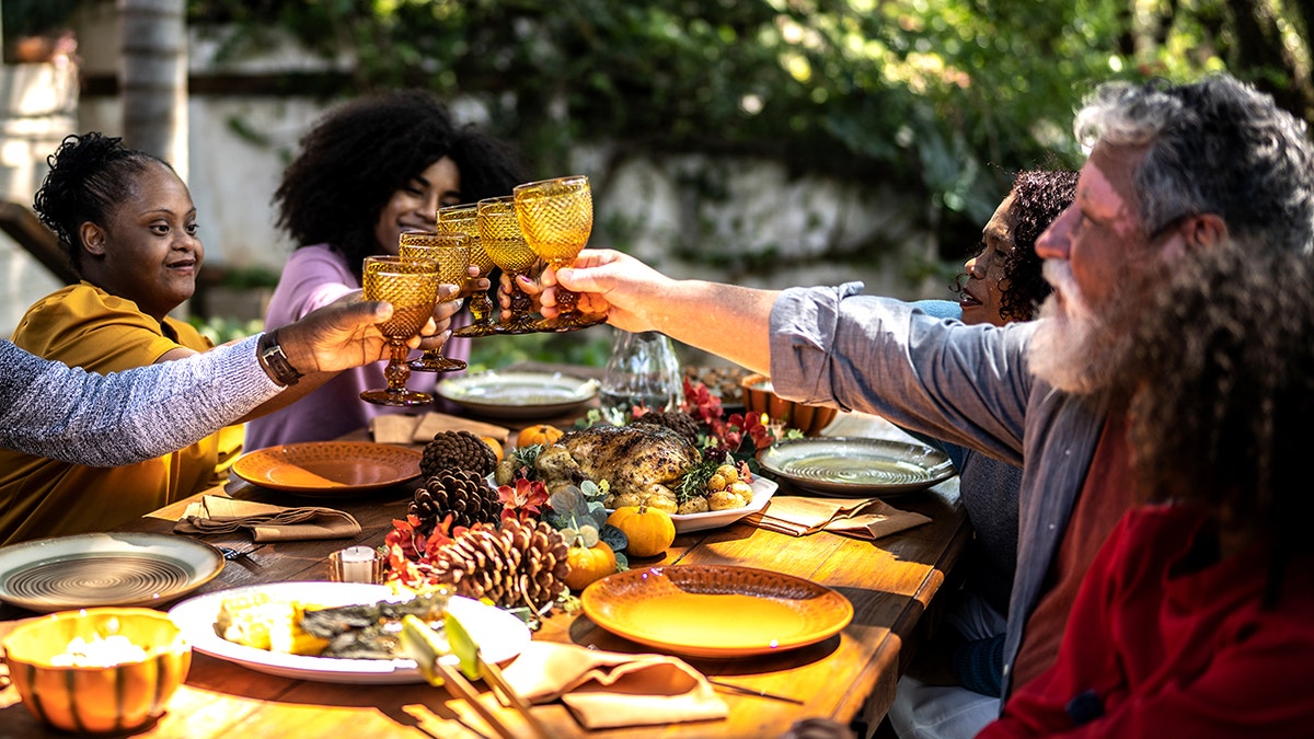 Family toasting on Thanksgiving at home