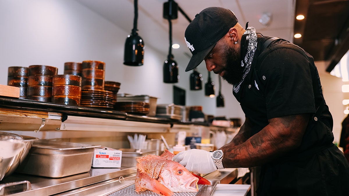 Tobias Dorzon seen preparing a dish