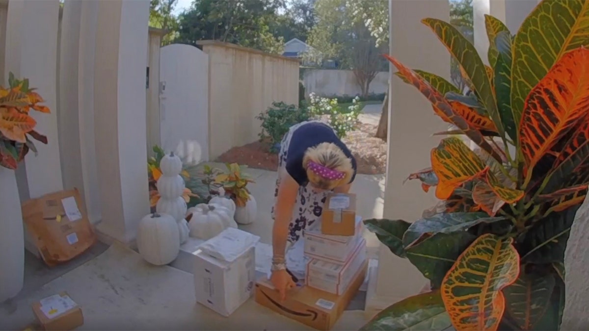 Surveillance footage shows Todd Bond allegedly carrying stolen packages to his car