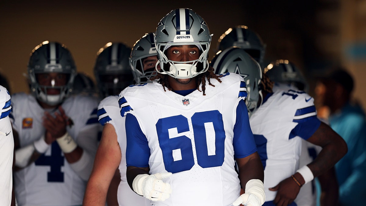 Tyler Guyton looks on