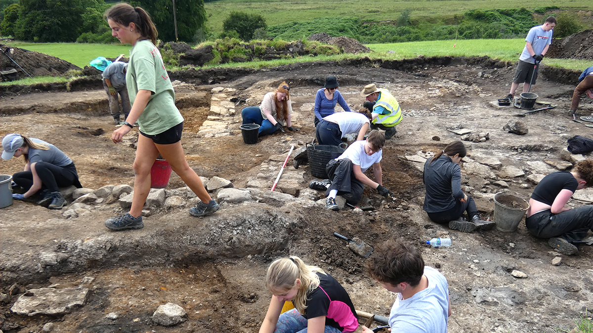 Volunteers digging at site