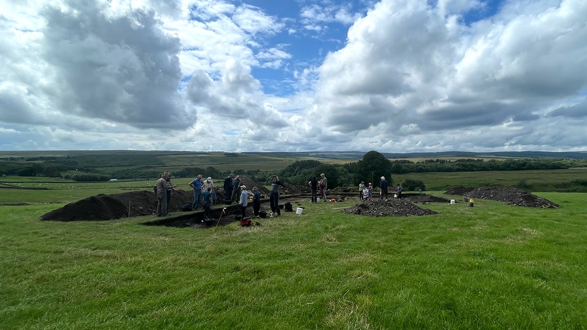Shot of group working in English countryside