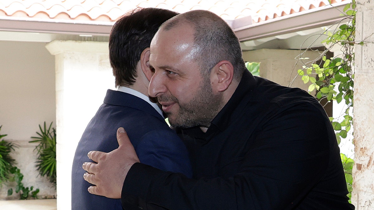 Umerov and Rubio hugging.