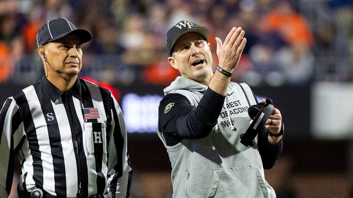 Jake Dickert talks to referee