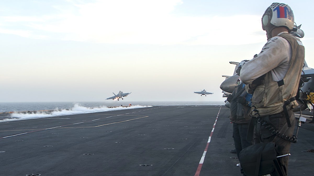 US aircrafts launching from an aircraft carrier