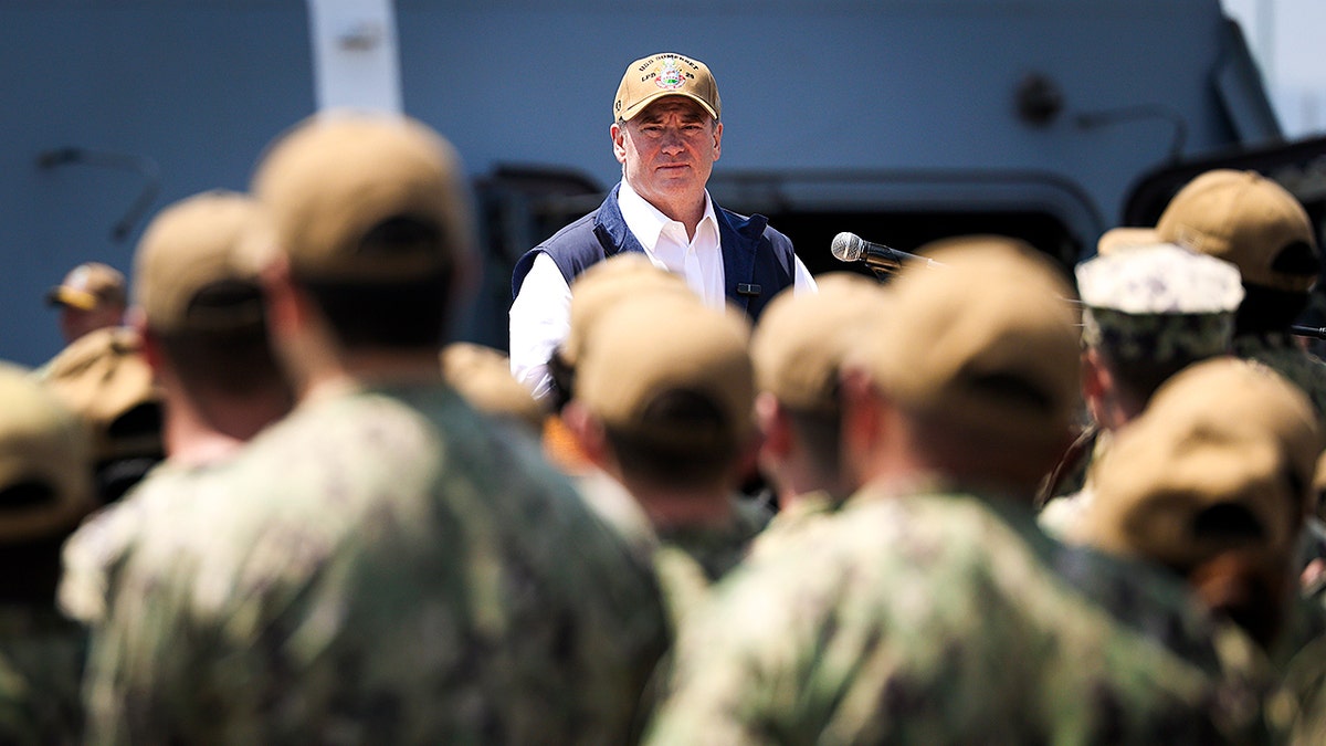 Navy Secretary John Phelan speaks to sailors