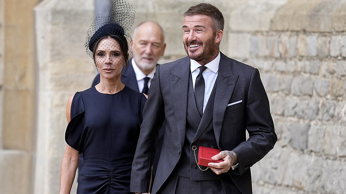 Victoria and David Beckham walking outside Windsor Castle