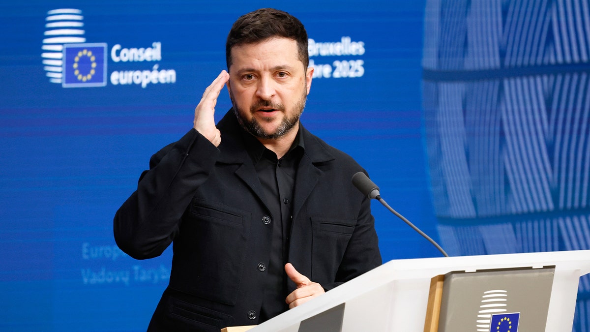 Volodymyr Zelenskyy delivers remarks at a press conference during an EU summit in Brussels.