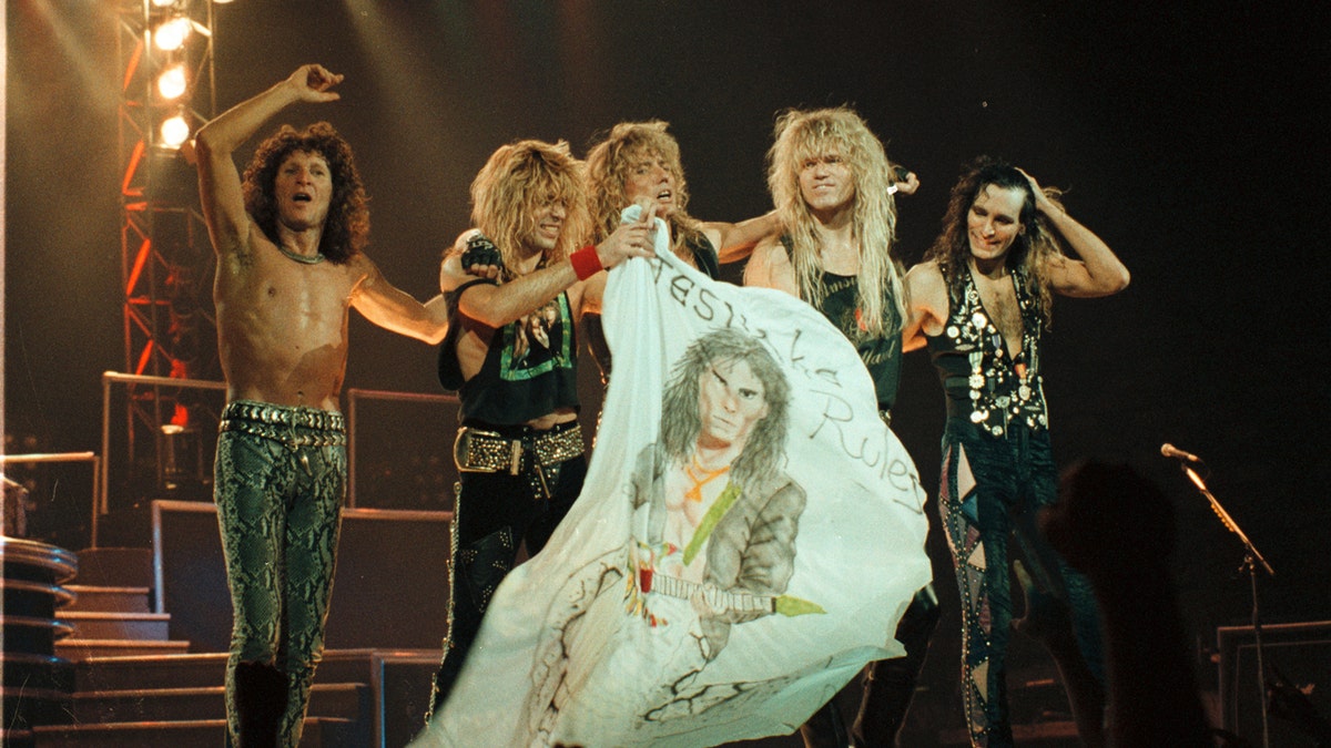 Whitesnake on stage performing