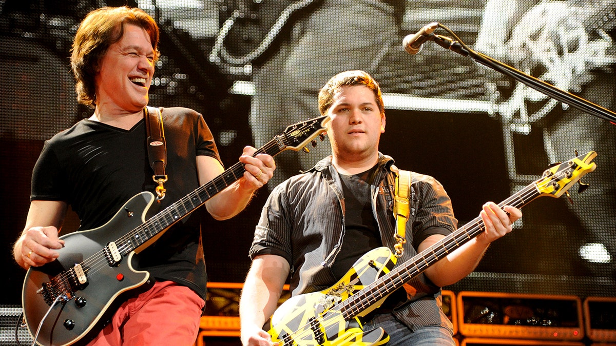 Wolfgang van Halen playing alongside dad Eddie van Halen in 2012