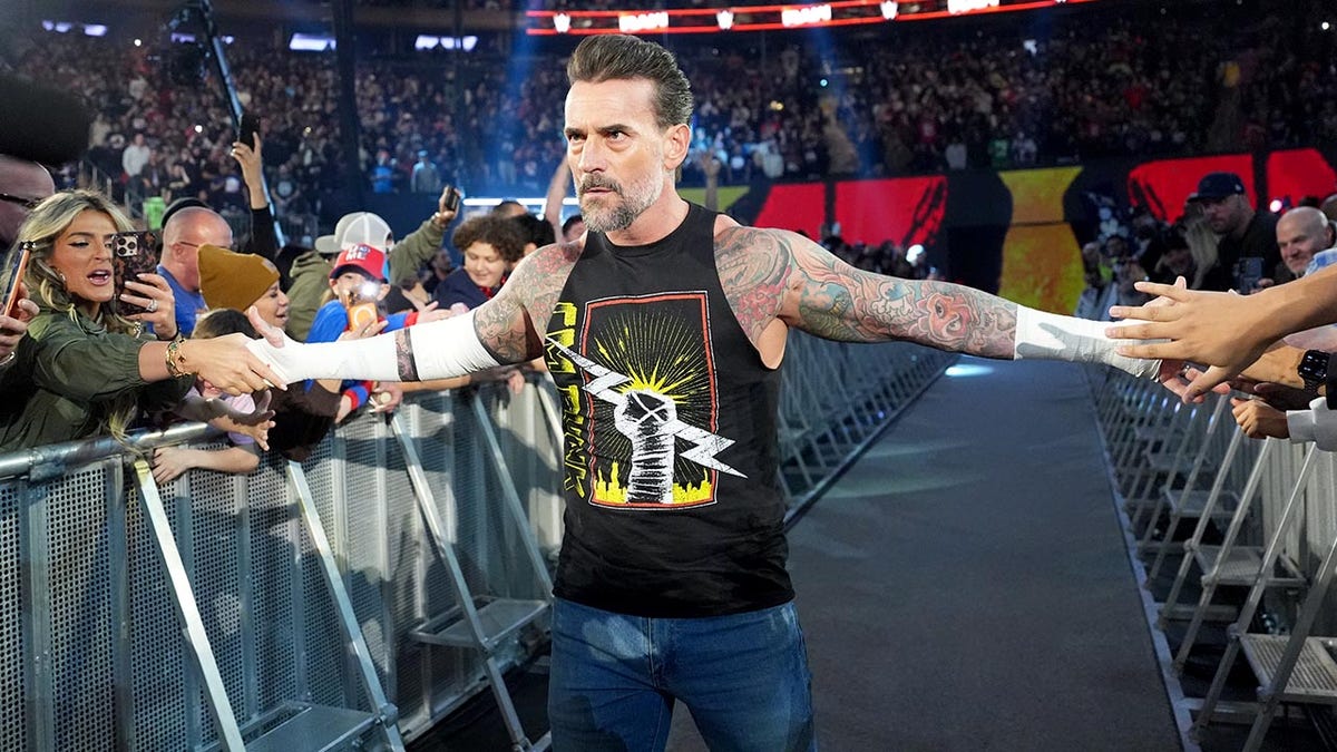 CM Punk comes down the aisle