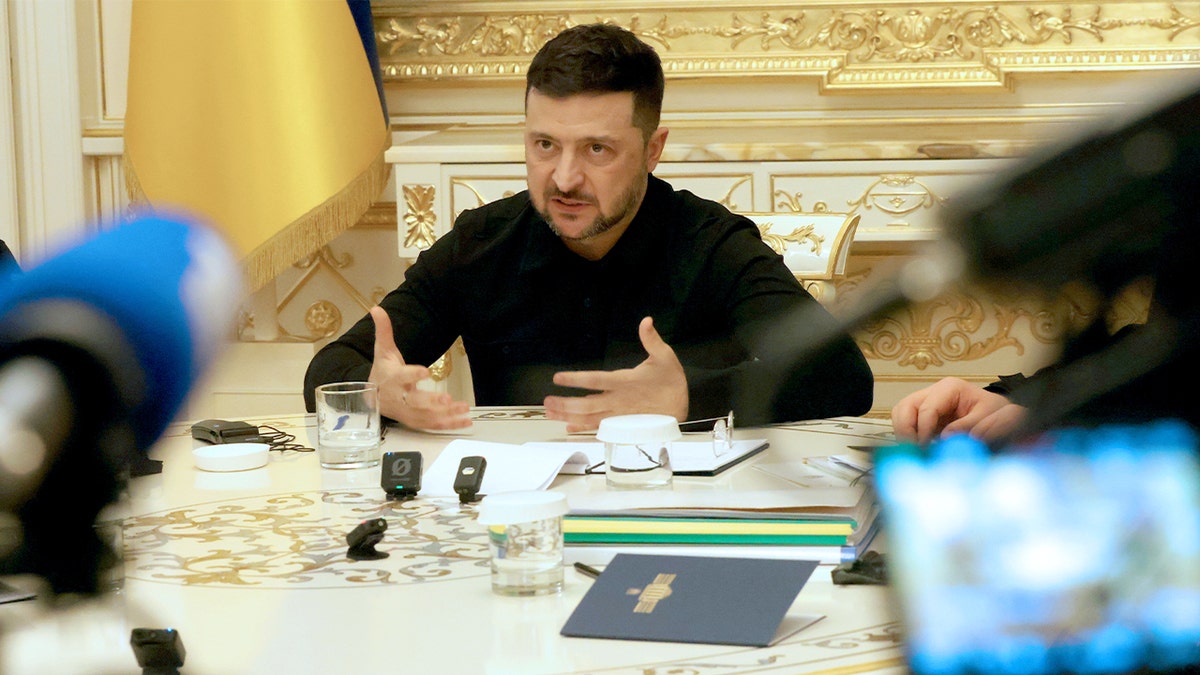 Ukrainian President Volodymyr Zelenskyy speaks during a press briefing at the presidential office in Kyiv.
