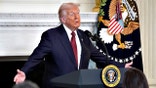 President Donald Trump gestures while speaking