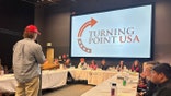 Jonah Flynn delivering presentation at Fort Lewis College
