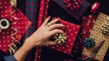 woman wrapping christmas presents