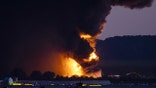 A fireball erupts near airport property