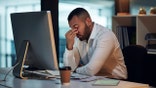 stressed man stressed in front of cpmputer