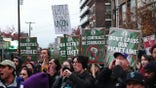 Starbucks strikers holding signs.