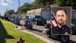 Motorcade with motorcycles and SUVS; injured Tennessee officer