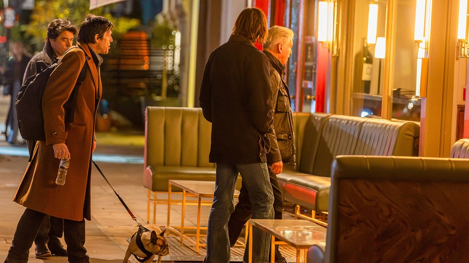 Brosnan family enters a restaurant together.