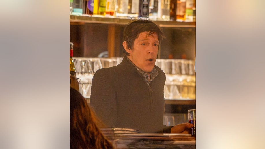 Christopher Brosnan sits at the bar inside Dorian restaurant in London during a family dinner.