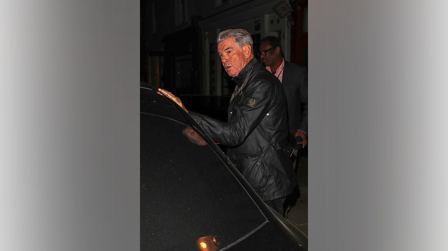 Pierce Brosnan gets into a car after his family dinner.