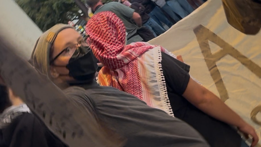 UC Berkeley protester attempts to block camera