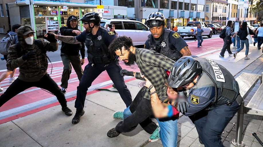 Protester at TPUSA event at Berkeley detained by police