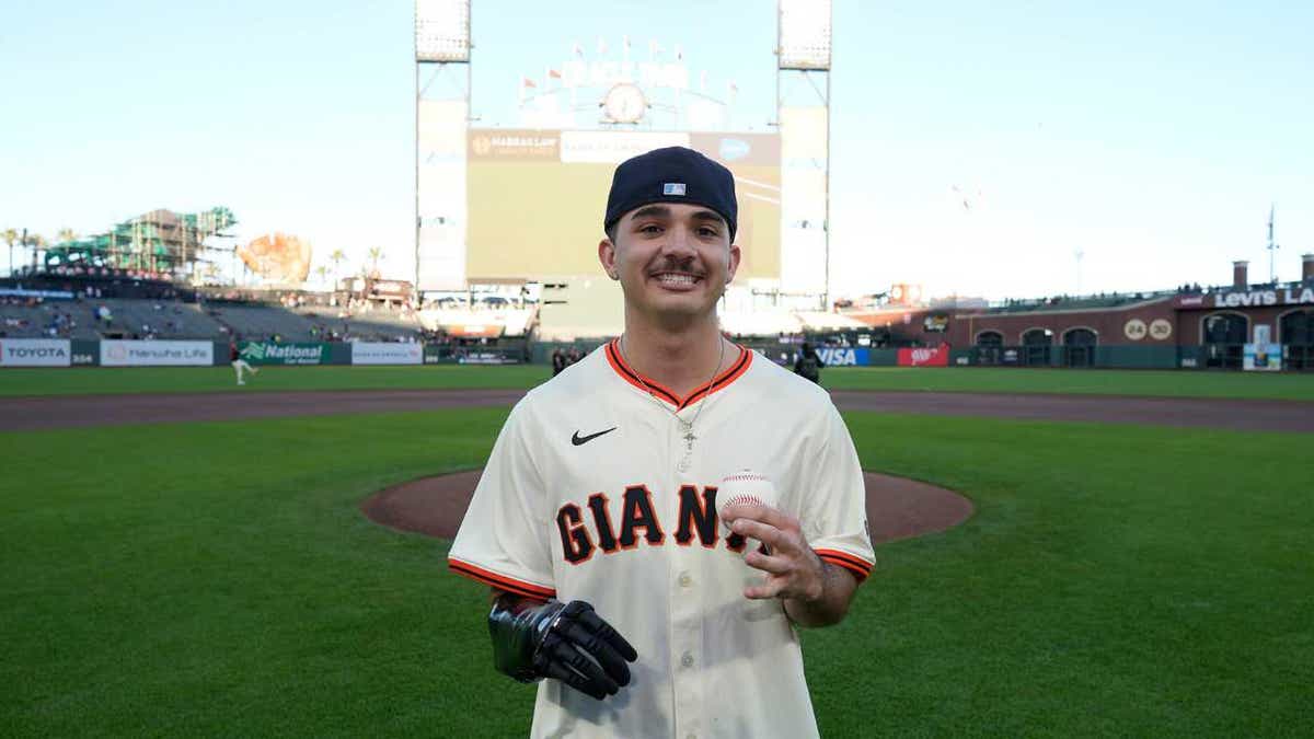 Grohsong posing with a baseball.