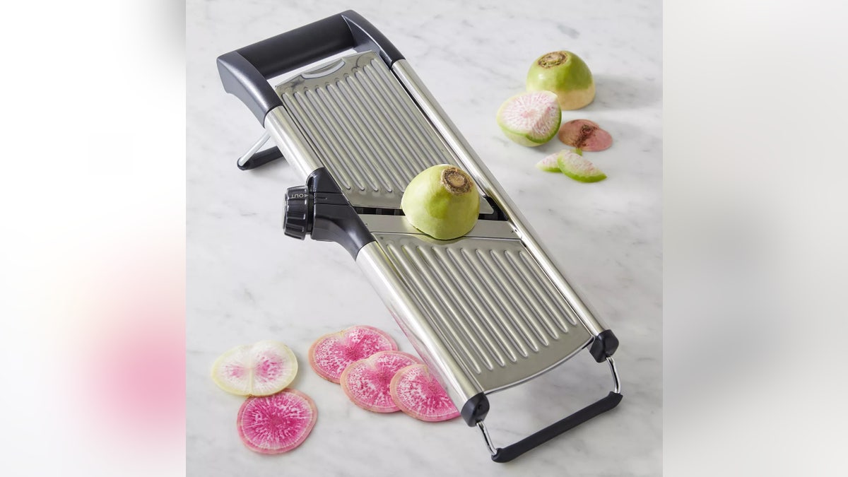 This mandoline keeps your fingers safe.