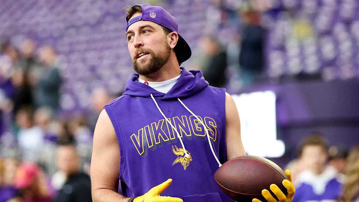 Adam Thielen looks on field