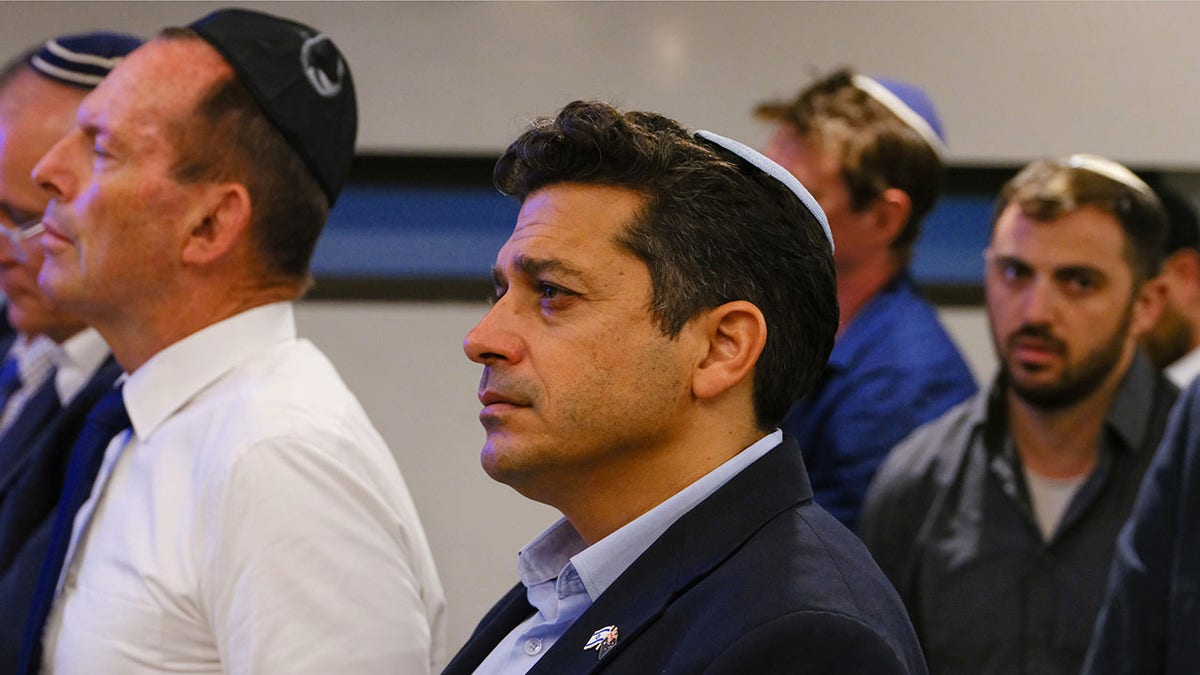 Amichai Chikli, Israel's minister of diaspora affairs at a funeral.