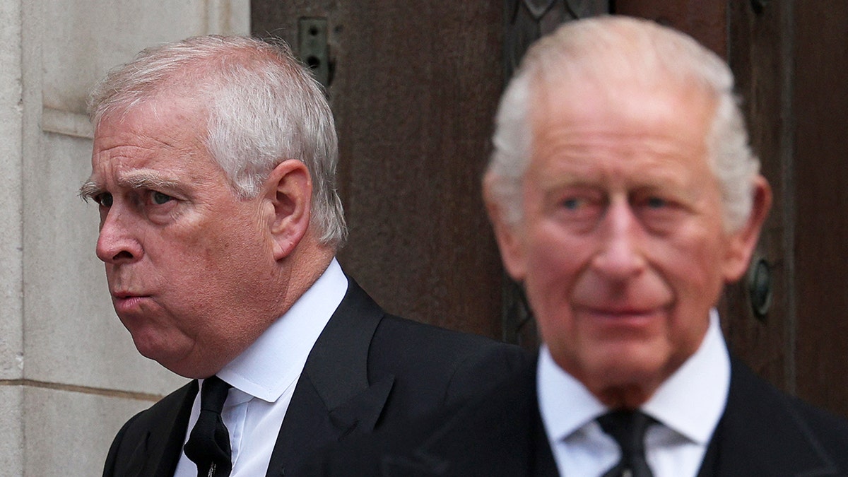 King Charles looking concerned and away from a worried ex-Prince Andrew.