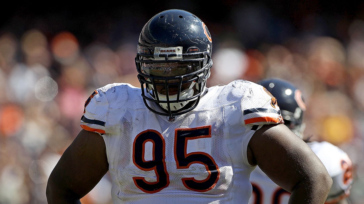 Anthony Adams looks on