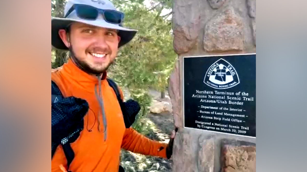 Austin Dirks smiles as he poses for a photo