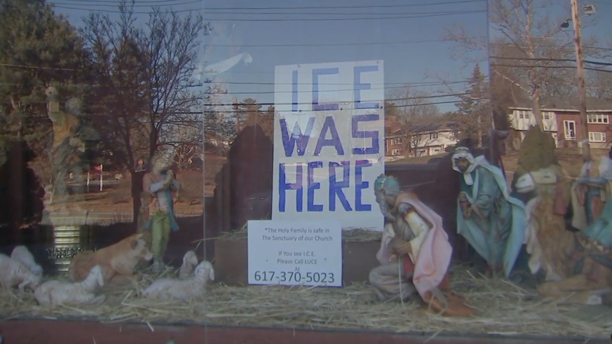 Nativity scene with "ICE WAS HERE" sign