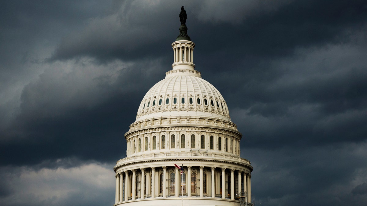 Capitol building and a stormy sky.