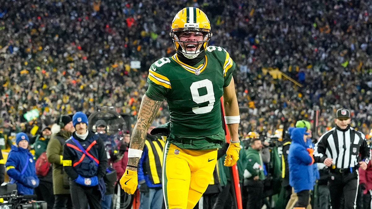 Christian Watson celebrates touchdown