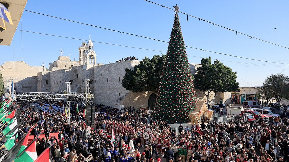 Crowds gather in Bethlehem for Christmas Eve