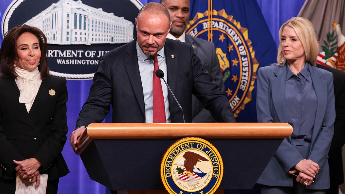 FBI Deputy Director Dan Bongino speaks from a lecturn.